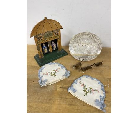 A 1920's Chad Valley kendella weather house measures 19cm high also a carved shell depicting The Last Supper also two egg cos