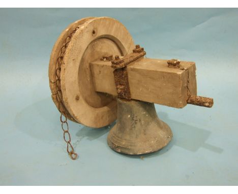 A bell tower bronze bell complete with stock and wheel, bell height 18cm, diameter 24.5cm, (stock cracked). 