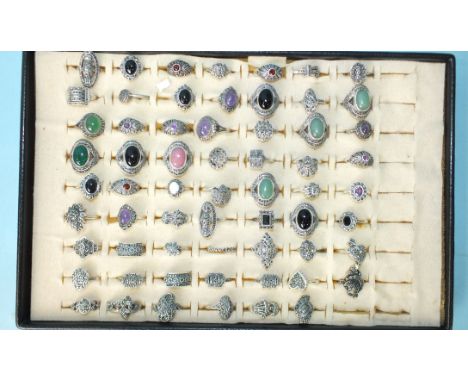 Sixty-two silver rings set marcasite, some set coloured stones and pastes, all marked 'Silver', 279g, sizes L-R. 