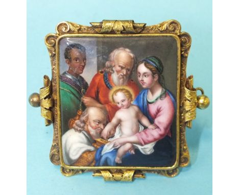 A 19th century Continental gold brooch with painted enamel plaque titled on reverse Adoration des Mages, 53 x 59mm, 16.2g. 