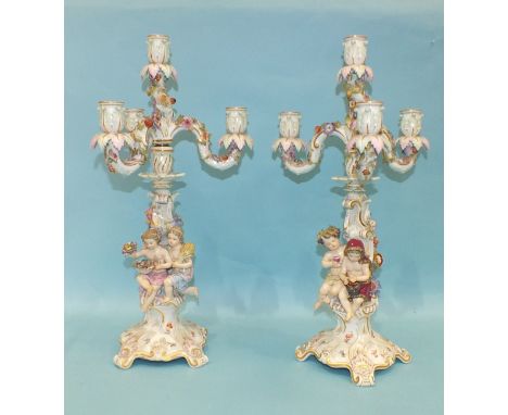 A pair of 19th century Meissen porcelain three-branch candelabra representing Winter and Autumn, each stem with two-part writ