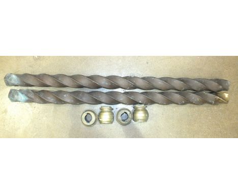 A pair of twist brass canopy supports with capitals for a steam engine, 125cm and 128cm long, (2). 