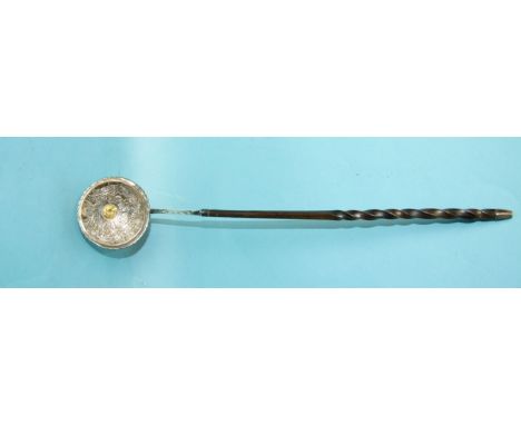 A George III silver toddy ladle with embossed foliate and scroll decoration, inset a gold ¼-guinea coin and engraved MIY 1763