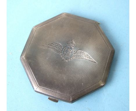 An engine-turned silver compact of hexagonal shape, with engraved RAF wings to lid, London 1941, 7.6cm. 