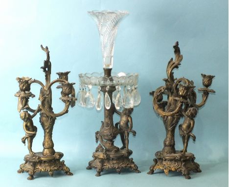 A late-19th century bronzed metal and cut-glass epergne supported by a vase column and putti, on Rococo plinth, 50cm high and