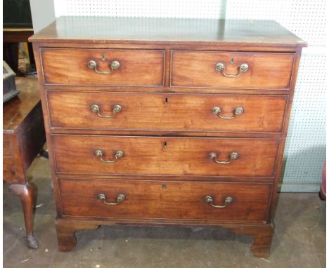 A late-Georgian mahogany chest of two short and three long cockbeaded drawers, on bracket feet, 106cm wide, 110cm high, in tw