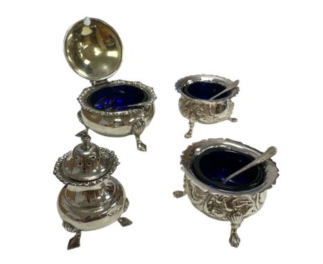 Two silver salts and a mustard pot with blue liners and spoons. Also a silver sugar shaker.&nbsp; Total weight 309g. Mustard 