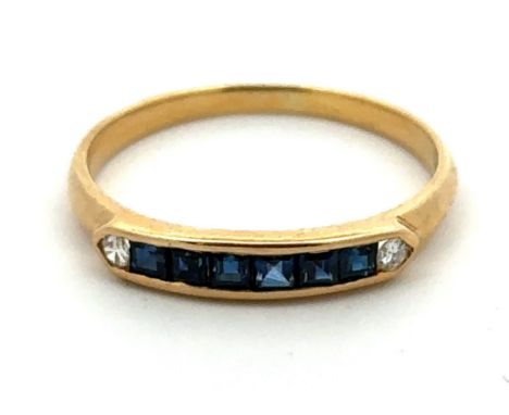 An 18ct gold, channel set sapphire and diamond ring, stamped 750. Size K. weight 1.39g. Please see the buyer's terms and cond