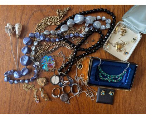 A selection of costume and silver jewellery including a 925 box chain with missing link, a silver locket pendant, a white sto