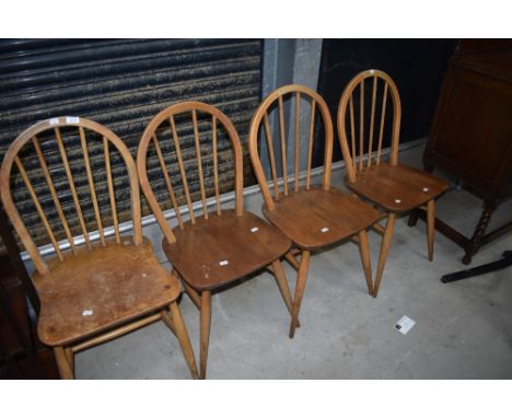 A matched set of four (three and one) hoop and stick back Ercol kitchen dining chairs