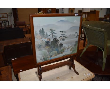 An early 20th Century mahogany folding fire screen table having Japanese silk inset