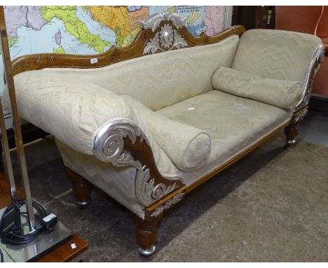 A 19th century carved mahogany-framed rollover-arm salon sofa, with painted mounts, on turned legs, L200cm 