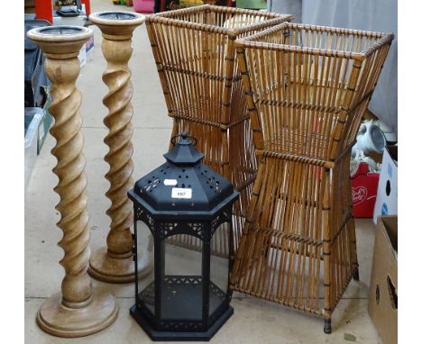 A pair of baskets, a pair of candle stands, and a lantern 