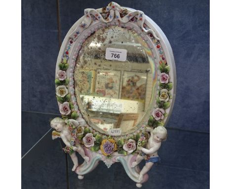 Vintage Continental porcelain strut mirror, with applied flowers and cherubs, 33cm 