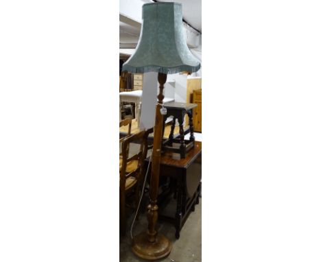 An Indian carved hardwood standard lamp and shade 