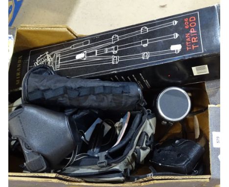 A Canon camera, accessories, and tripod 