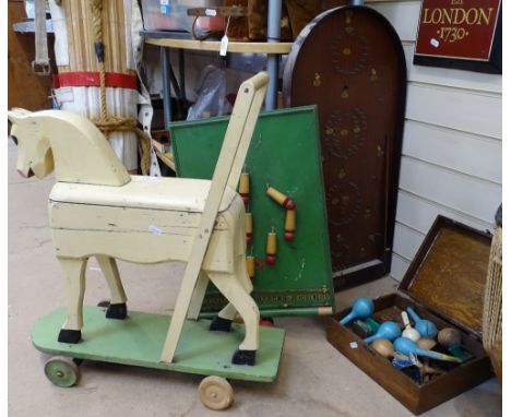 A Vintage painted wood toy horse on wheels, height 64cm, a Bagatelle, another game etc 