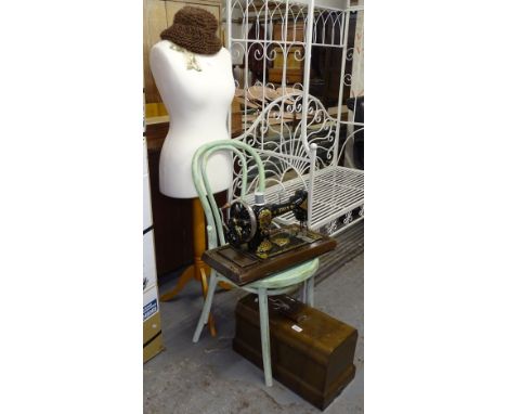 A walnut-cased Jones sewing machine, a bentwood chair, and a modern mannequin 