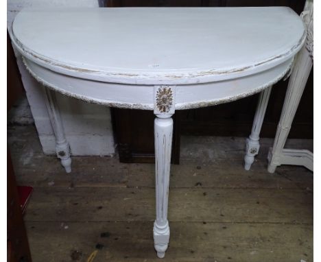 A white painted demilune console table with fluted legs, W91cm, H75cm 