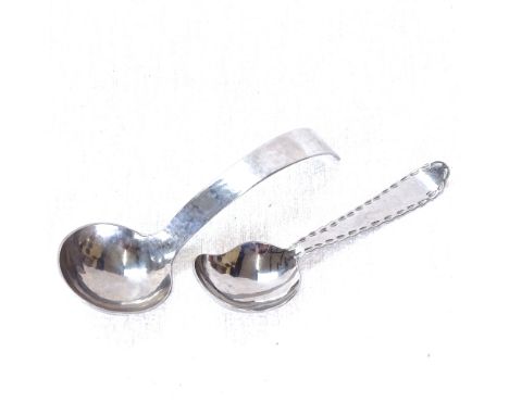 2 white metal Keswick caddy spoons, largest 13cm 