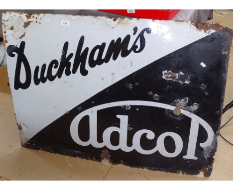 A Vintage enamel sign advertising Duckham's Adcop, length 102cm 