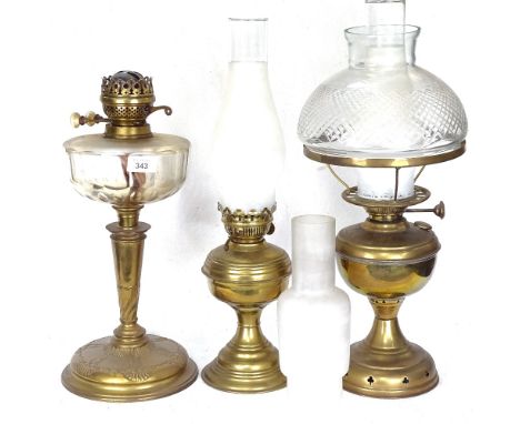 A brass oil lamp with shade and chimney, 52cm, and 2 others 