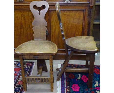 A pair of Arts and Crafts oak tripod chairs 
