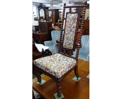 A Victorian rosewood bobbin turned nursing chair 