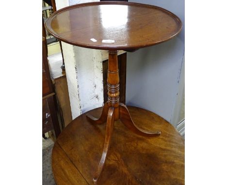 A 19th century mahogany tilt-top table on turned centre column, and tripod base, W54cm 