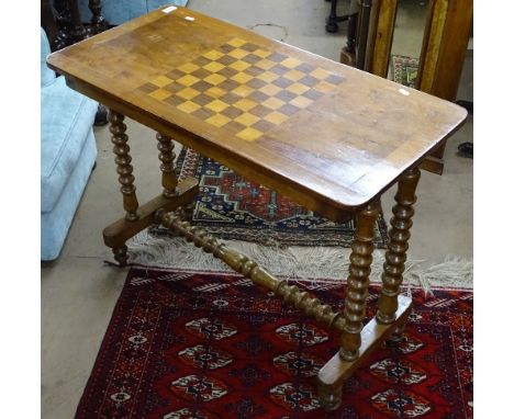 A Victorian walnut games-top stretcher table, with bobbin turned legs, W89cm, H70cm 