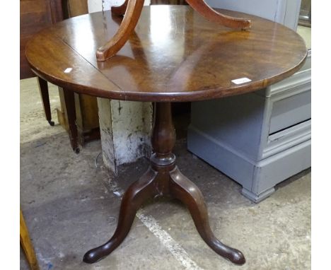 An 18th century oak tilt-top table with circular top, on tripod base, W76cm 