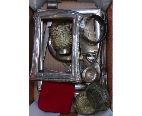 Silver-fronted photo frames, a pair of Indian white metal goblets, silver bangle etc 