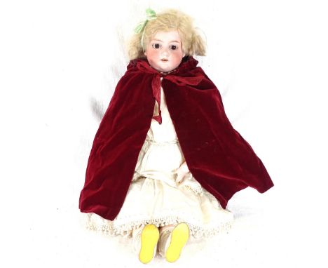 A Vintage porcelain-head doll with jointed limbs and original clothes, height 56cm 