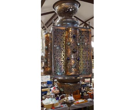 A large Moroccan style hanging metal lantern with inset stones, height approx 85cm 