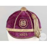 A purple velvet schools Cricket Cap