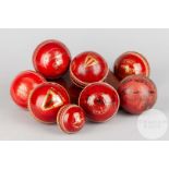 A collection of eight assorted cricket balls