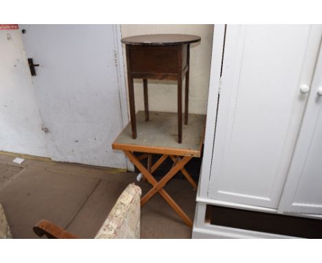 A folding card table and sewing box