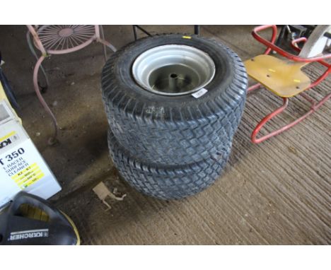 A pair of lawn tractor wheels