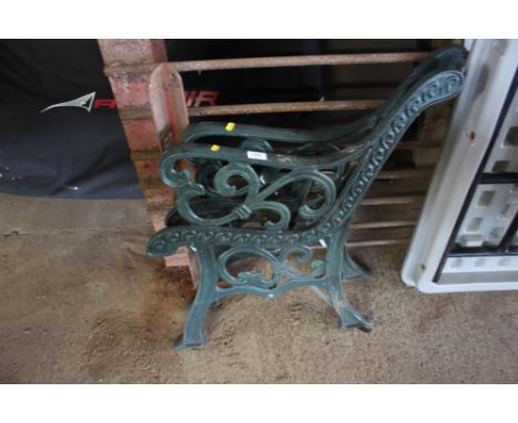 A pair of metal bench ends 