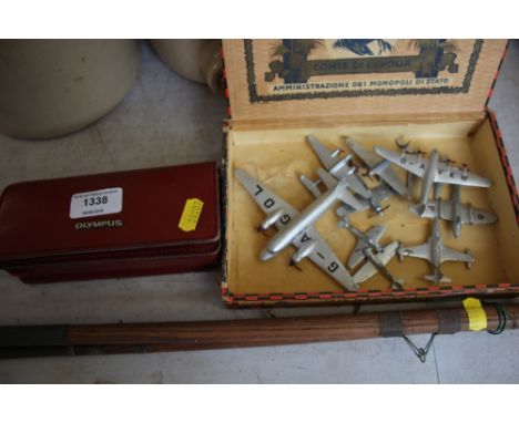 A box of Dinky model planes; together with a camera
