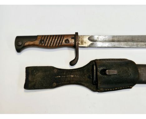 A WWI German Mauser bayonet, with steel scabbard and leather frog