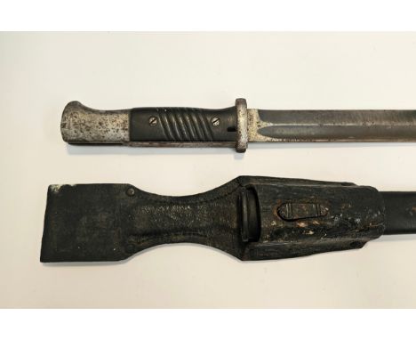 A Third Reich era German Mauser bayonet, stamped 37 to blade back (1937), serial number 7594, blade by F.W. HOLLER, with scab