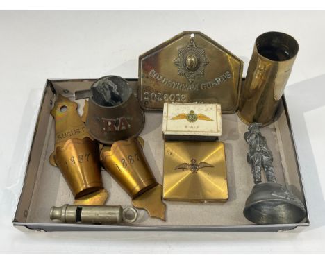A tray of miscellaneous including Coldstream Guards identification plaque, shell case and RAF badge powder compact etc