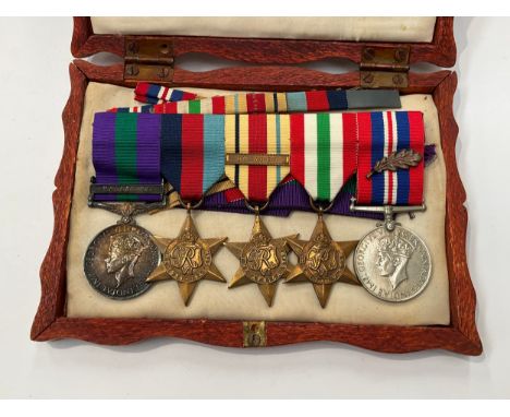 A WWII and later medal group of five consisting of 1939-45 star, Africa star (with 8th Army clasp), Italy star and War medal 