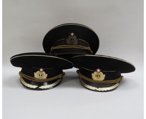 Seven USSR Russian Soviet peaked visor caps: Border Guard (green with red piping), Air Force (blue with blue piping), Profess