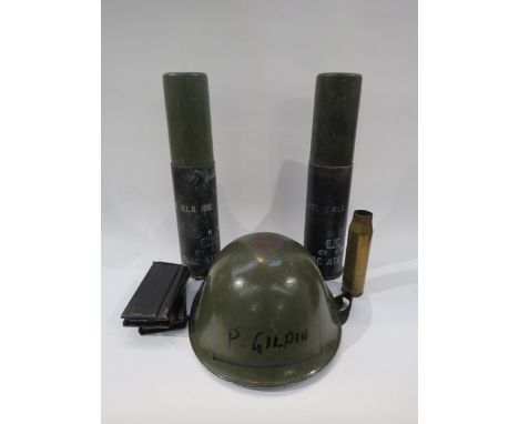 A post war British army helmet together with two post war practice shells, another and two magazines (6)