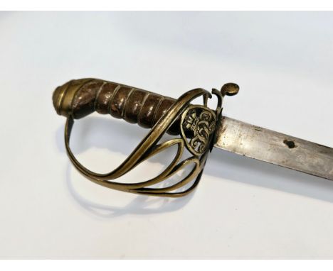 A Victorian Infantry Office's sword circa 1860, a later variation of the 1822 pattern, Gothic brass hilt with cypher (split) 