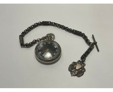 A British Military pocket watch, black face with Arabic numerals, second subsidiary, marked GS/TP P40264 with broad arrow, wi