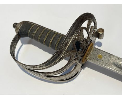 A Victorian Queen's Westminster Rifle Volunteers officer's sword with steel scabbard. Scabbard only fits other way round