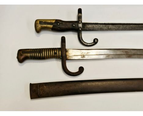 A 19th Century French Chassepot sabre bayonet with scabbard together with a Gras bayonet, no scabbard (2)